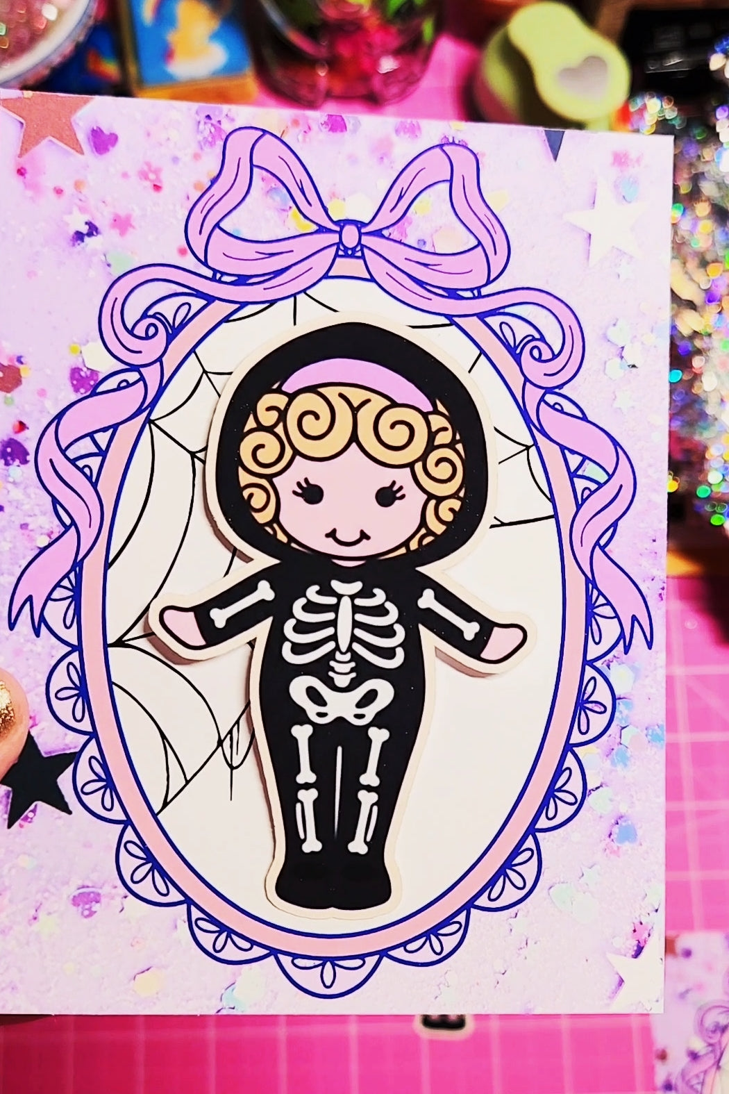 Illustration of a skeleton girl with a bow in a frame on a colorful background