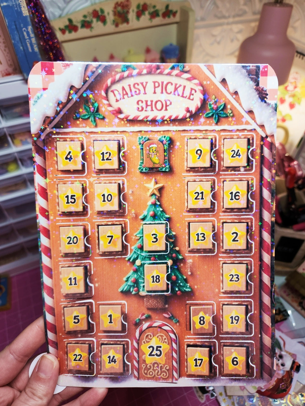 Advent calendar with 'Daisy Pickle Shop' branding, featuring a gingerbread house design.