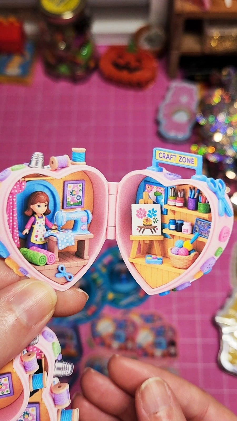 Toy with a craft zone theme held by a hand on a colorful background