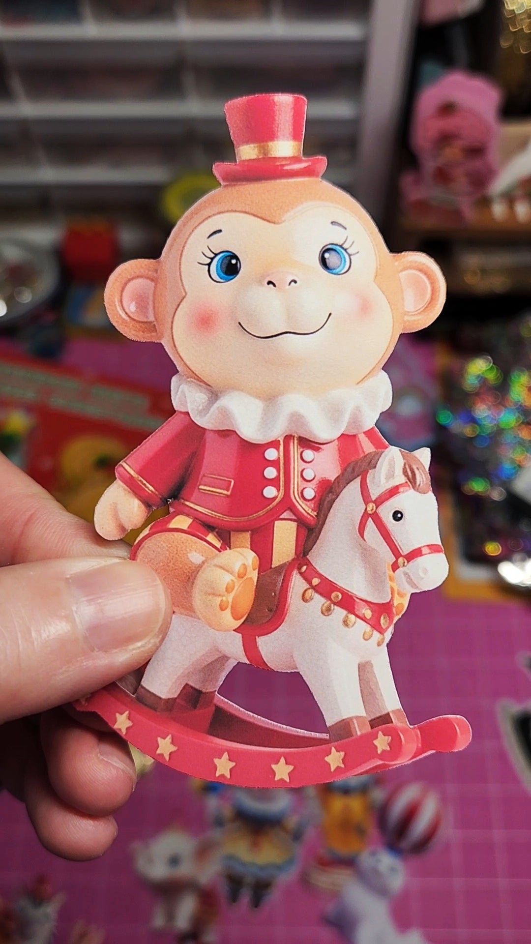 Cartoon monkey figurine with a horse on a colorful background