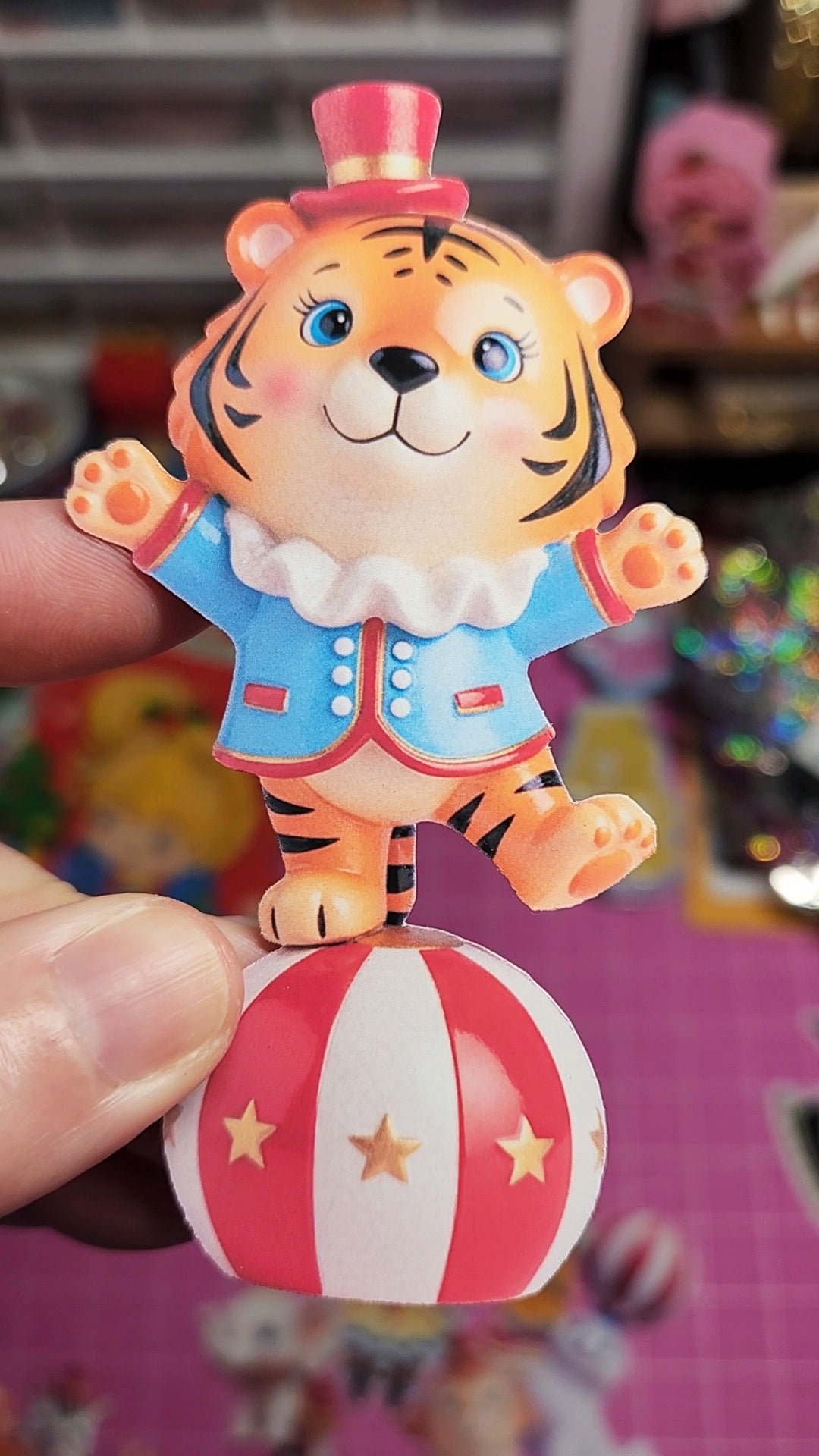 Circus-themed tiger figurine on a colorful background