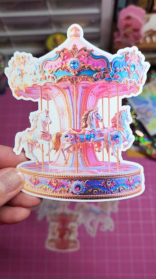 Colorful carousel toy held by a hand on a checkered surface