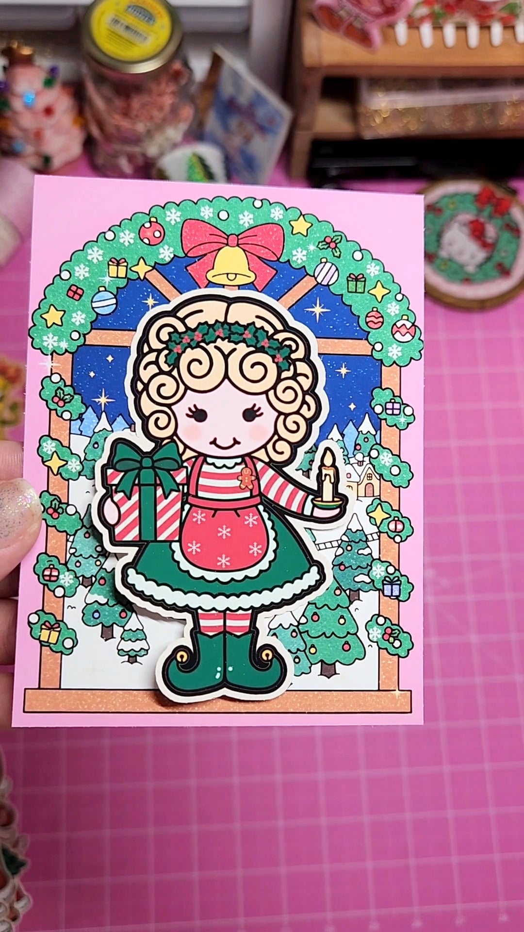 Illustration of a girl with Christmas-themed elements on a pink background