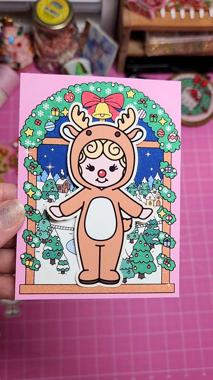 Card with a cartoon character in a reindeer costume on a pink background