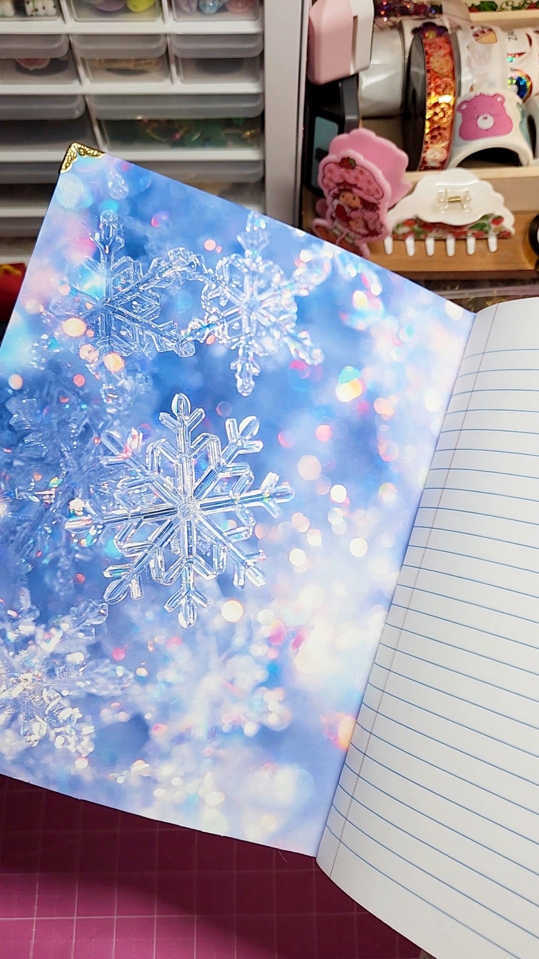 Sheet of paper with snowflake design on a notebook