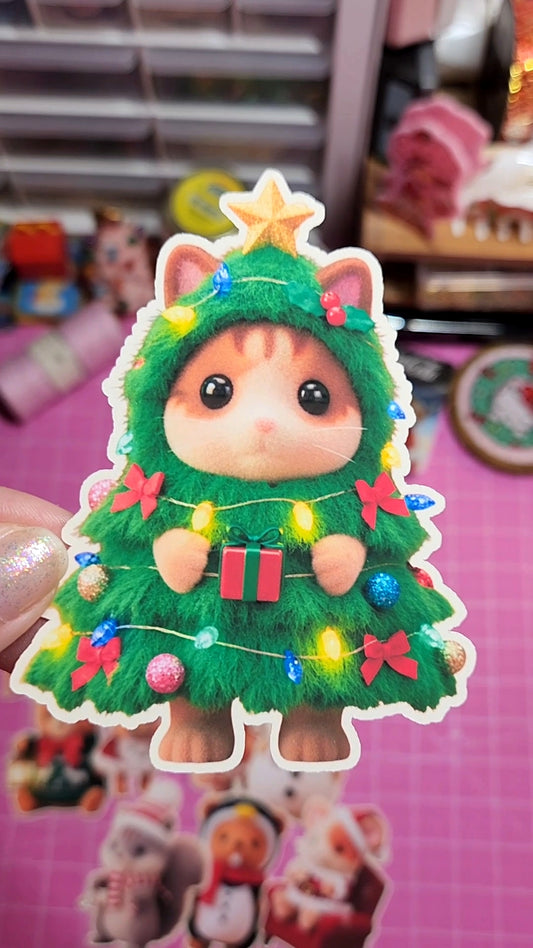 Cat-shaped Christmas tree decoration with lights and ornaments on a pink background