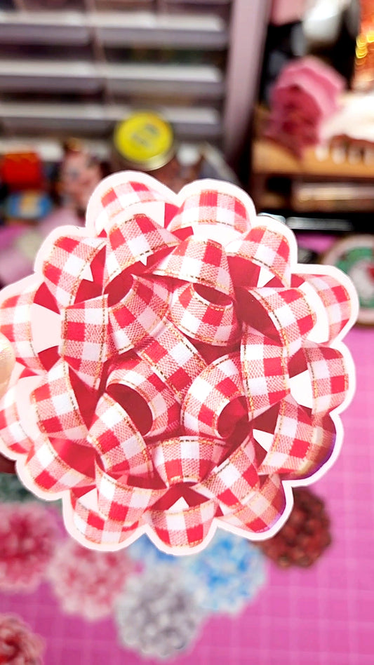Red and white checkered flower-shaped object on a blurred background