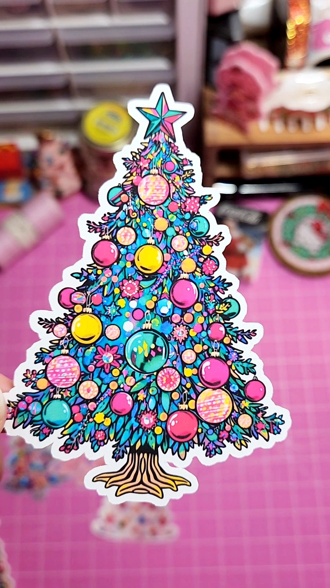 Colorful Christmas tree sticker on a pink background