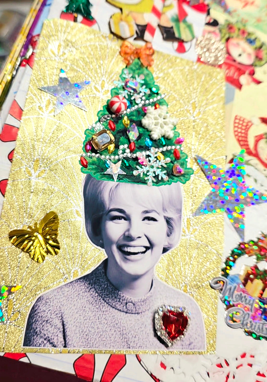 Collage with a woman's face wearing a Christmas tree hat surrounded by festive decorations.
