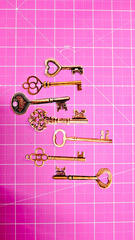 Vintage keys on a pink grid background