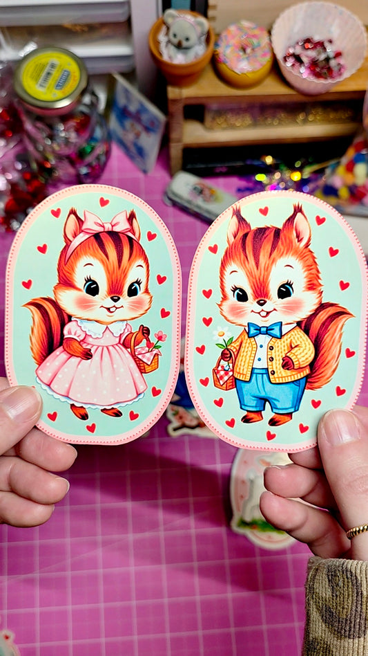 Two cartoon animal stickers held by a person against a colorful background.