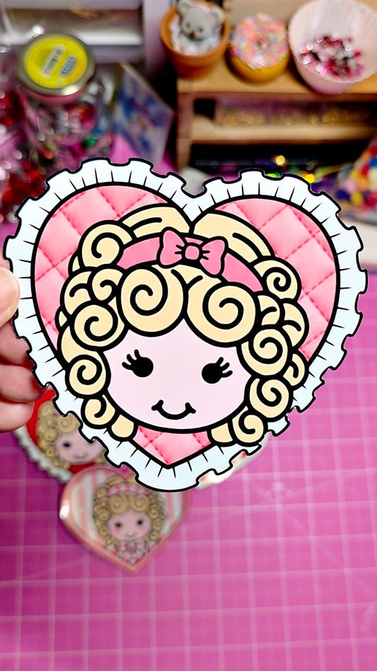 Heart-shaped sticker with a cartoon character on a pink grid background