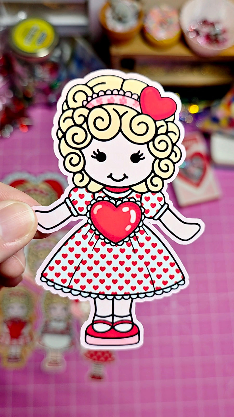 Cartoon character with a red heart on a pink checkered background