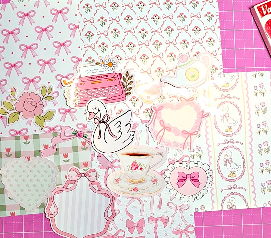 Collection of decorative paper sheets with floral, bow, and typewriter patterns.