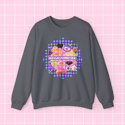A dark gray crewneck sweatshirt featuring a colorful retro-themed graphic with the text 'HAPPY KISSES WEEK' on a pink and purple gingham background, displayed against a light pink grid backdrop.