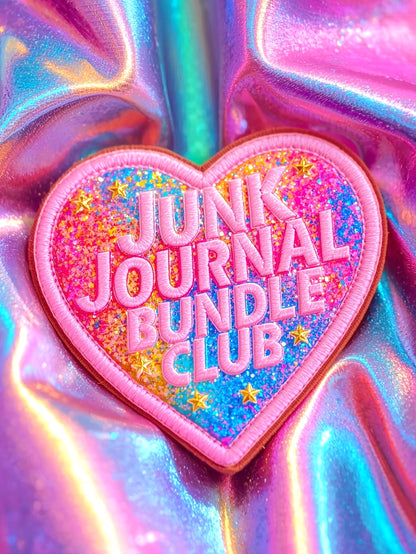 Heart-shaped patch with 'Junk Journal Bundle Club' text on a colorful, iridescent background