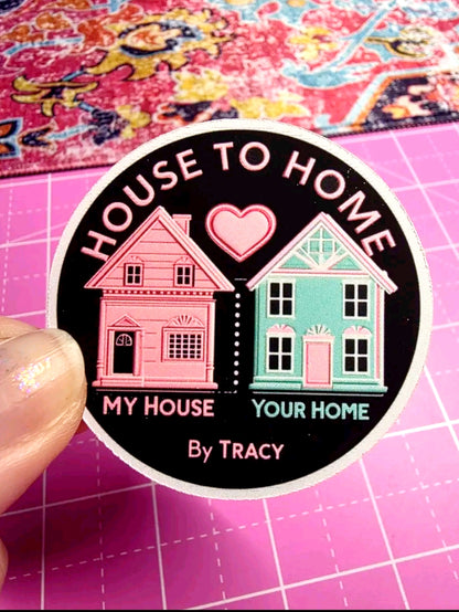Sticker with houses and text 'House to Home, My House Your Home by Tracy' on a pink grid background.