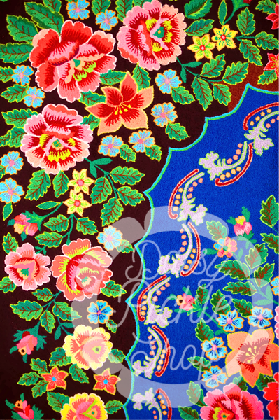 Colorful floral and paisley pattern on a dark background