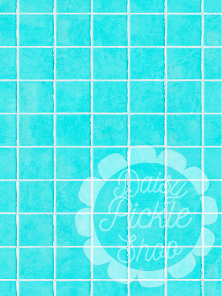Blue tiled wall with a decorative logo in the center