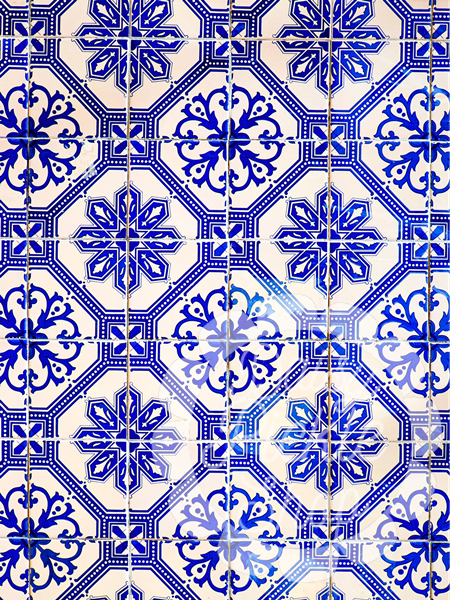 Pattern of blue and white tiles with intricate designs on a white background