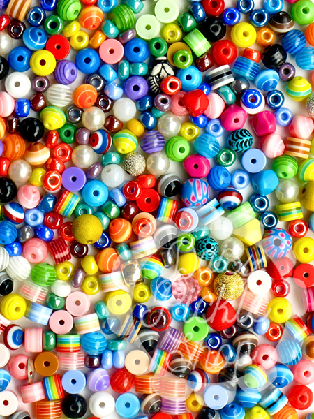 Assorted colorful beads of various shapes and sizes.