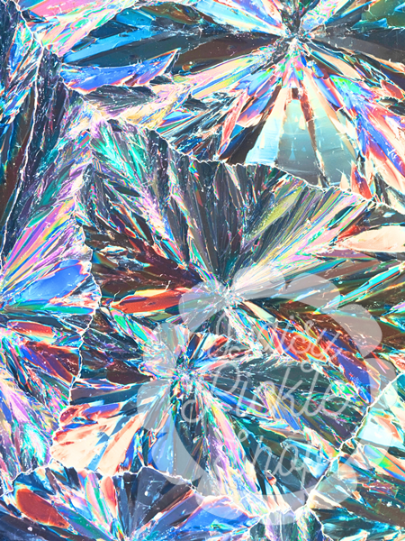 Close-up of a multicolored, textured surface with reflective patterns