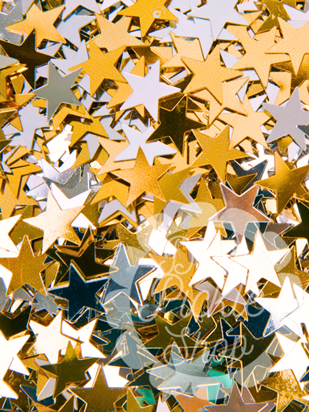 Close-up of gold, silver, and bronze star-shaped confetti on a white background