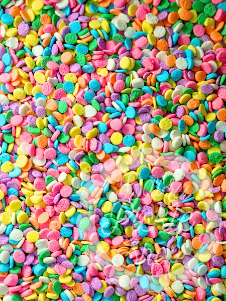 Colorful sprinkles in various shapes and sizes on a multicolored background