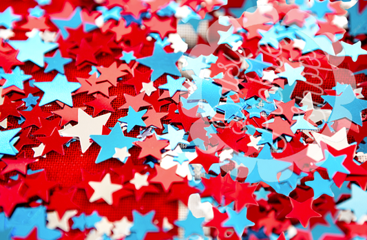 Confetti with red, white, and blue stars on a multicolored background