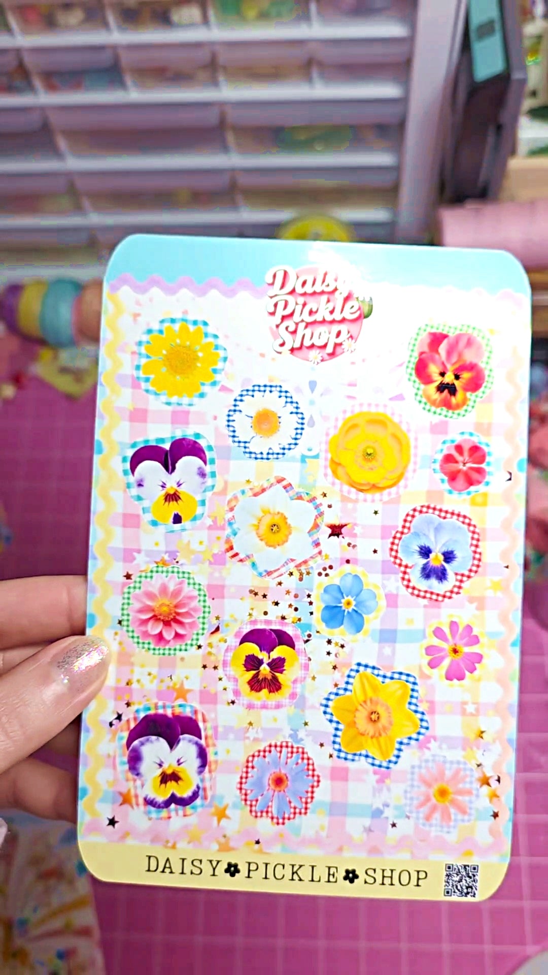 Decorative sticker sheet with colorful designs and 'Daisy Pickle Shop' branding.