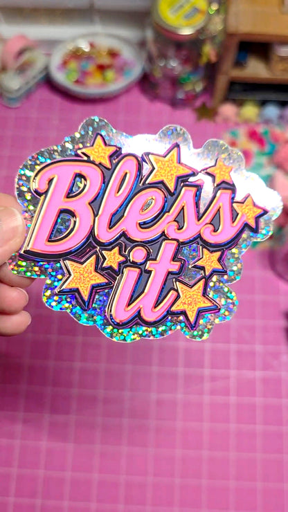 Sticker with 'Bless it' text held against a pink background
