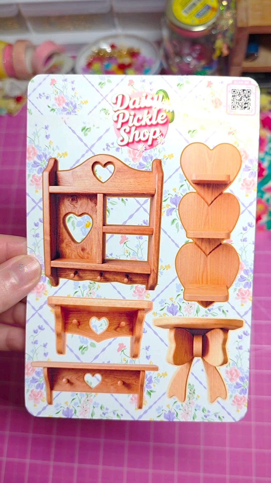 Wooden furniture with heart designs on a colorful card labeled 'Piddle Piddle Shop'.