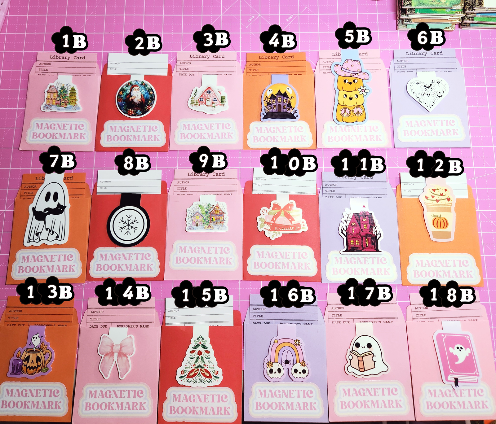 Set of magnetic bookmarks with various designs on a pink grid background