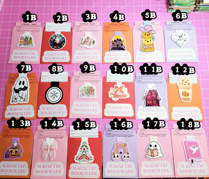 Set of magnetic bookmarks with various designs on a pink grid background