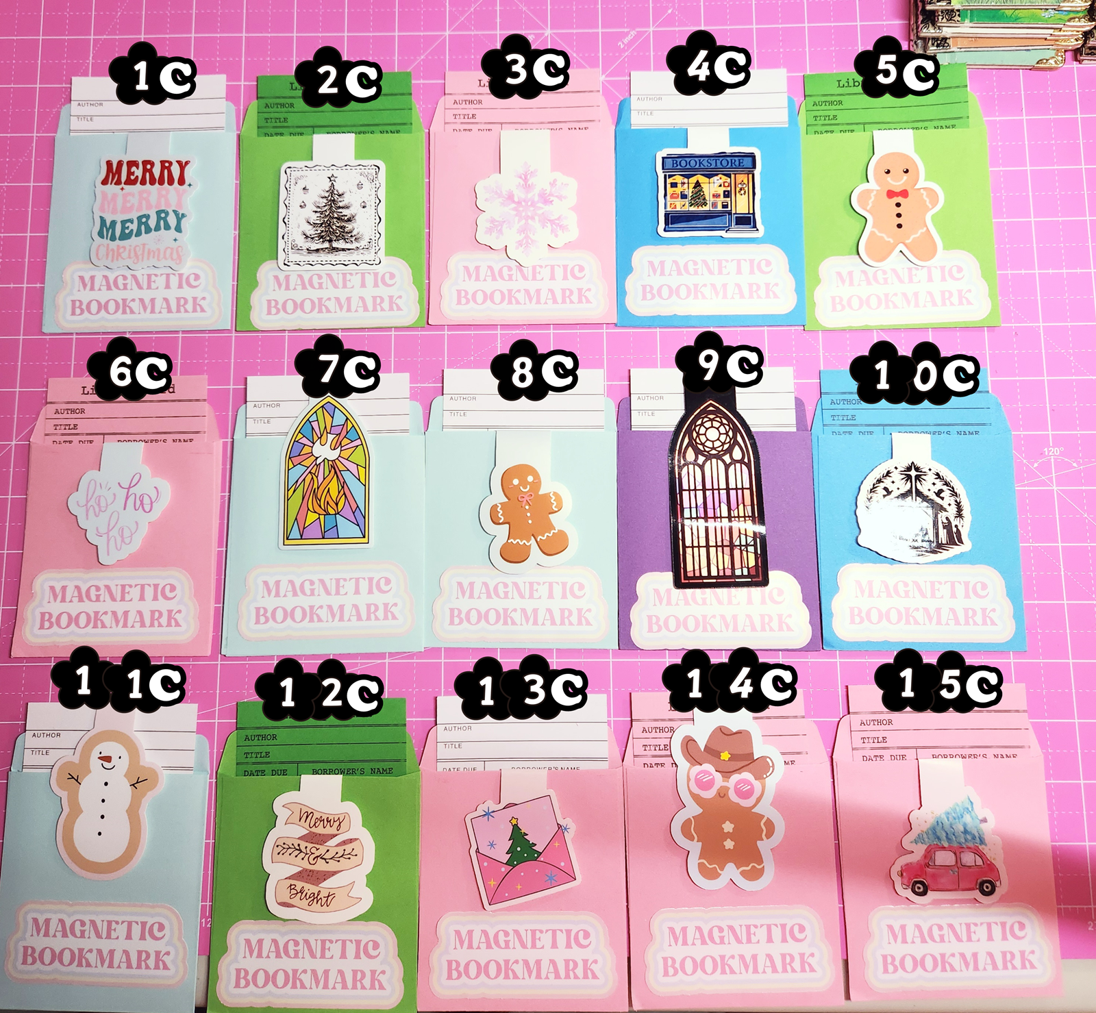 Set of magnetic bookmarks with various designs on a pink grid background