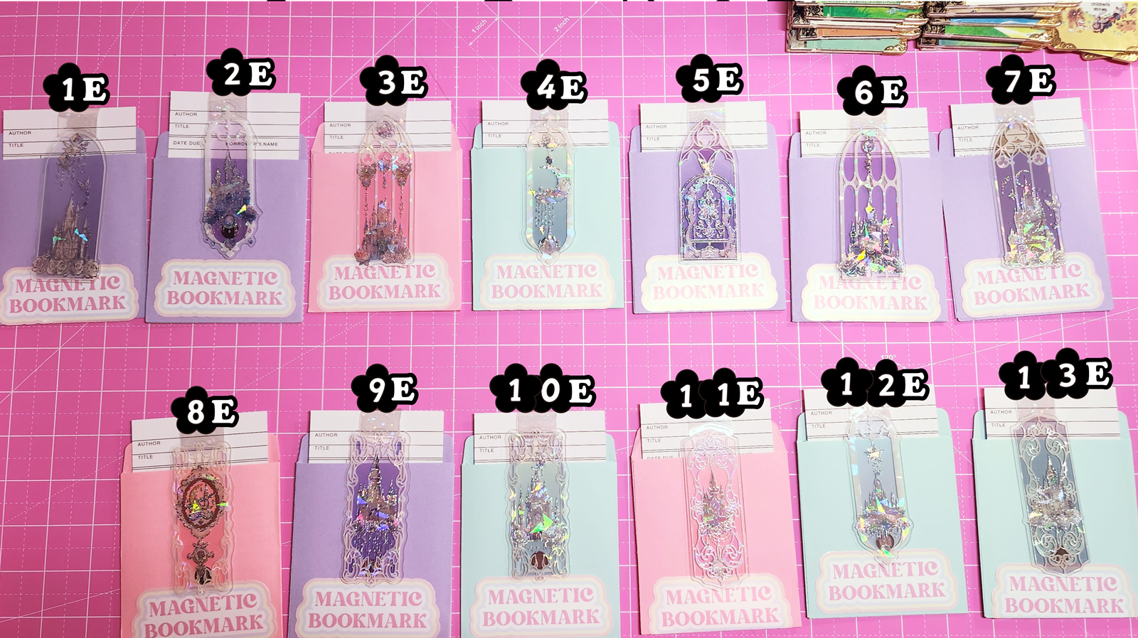 Set of magnetic bookmarks with various designs on a pink grid background