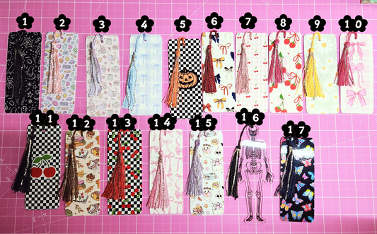 Collection of various bookmarks on a pink grid background